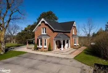 View of front of house with a front lawn and covered porch