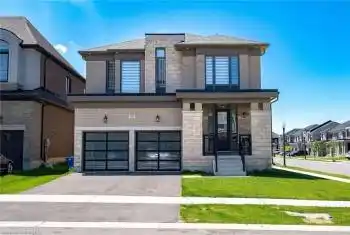View of front facade with a front lawn and a garage