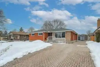 Single story home featuring a storage shed