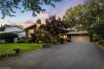 View of front of property with a lawn and a garage
