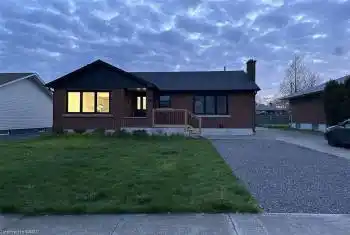 Ranch-style house with a front yard