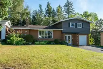 beautiful house on wooded lot