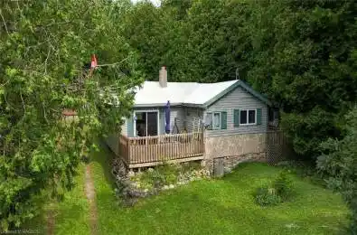 Spend the rest of your summer in this iconic Stokes Bay cottage featuring 3 bedrooms, 1 bath and a double deep lot!